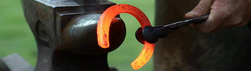Blacksmith anvil, hammer and horseshoe